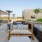 a patio with a table and chairs