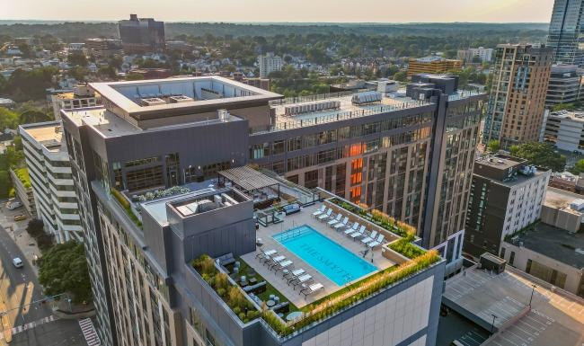 a large building with a pool in the middle of it
