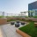 a patio with benches and plants