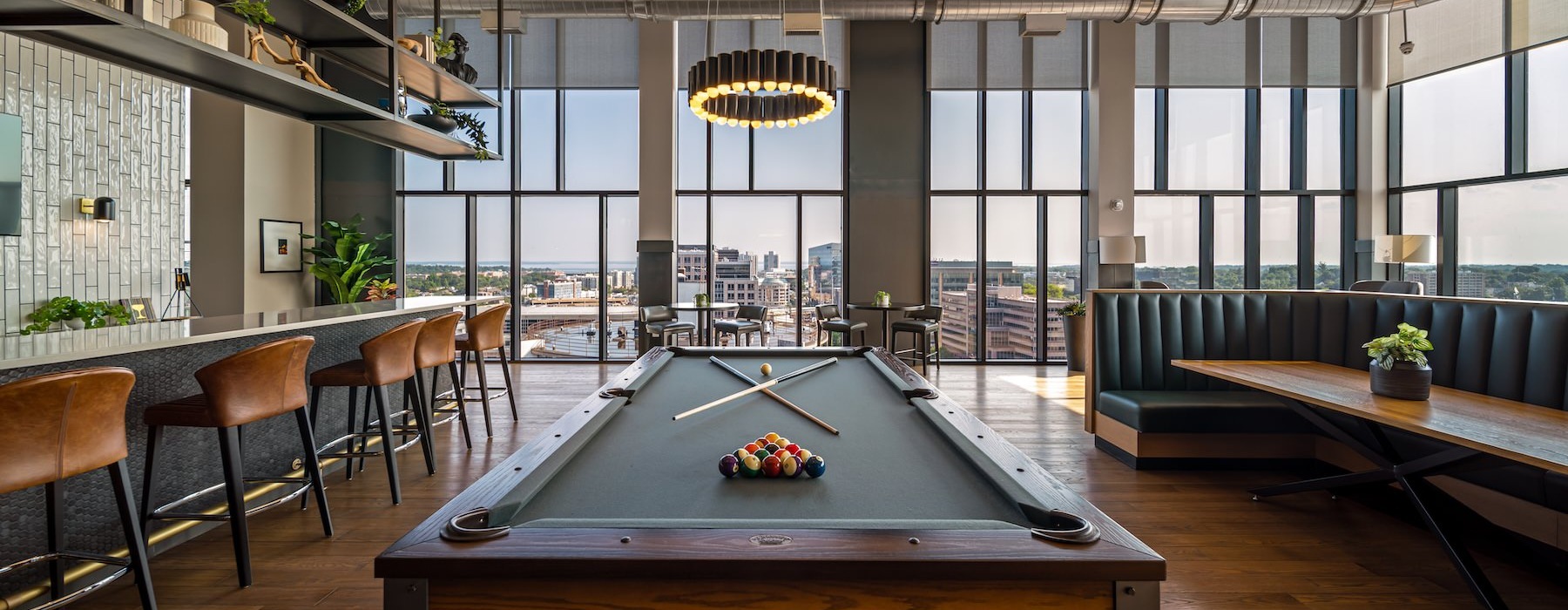 a pool table in a clubhouse room