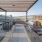 a grill area with tables and chairs