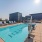a swimming pool with chairs around it