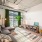 a living room with a rug and a large couch