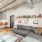 a living room with a couch and a rug