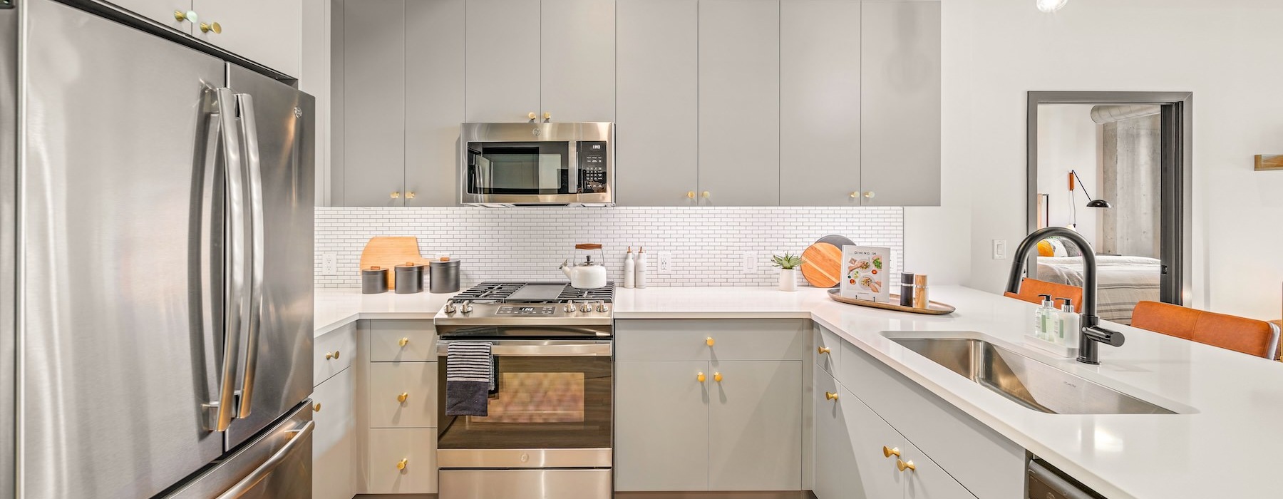 a kitchen with white cabinets