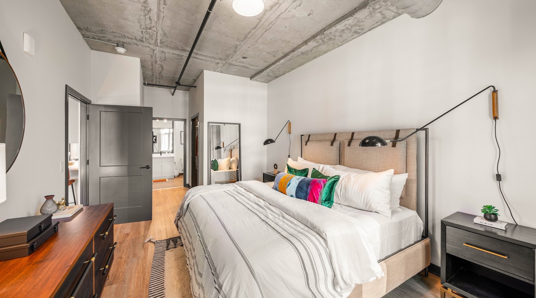 a bedroom with a bed and a nightstand