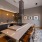 a clubhouse kitchen with a bar and chairs