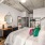 a bedroom with a bed and a mirror